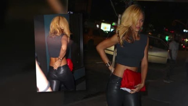 Rihanna Pulls Up Her Pants to Avoid a Wardrobe Malfunction