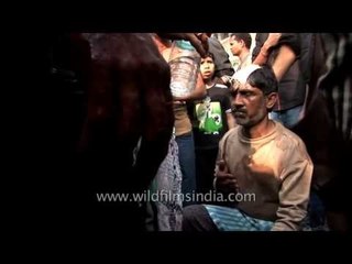 Mourner beating his chest even when he is getting padded