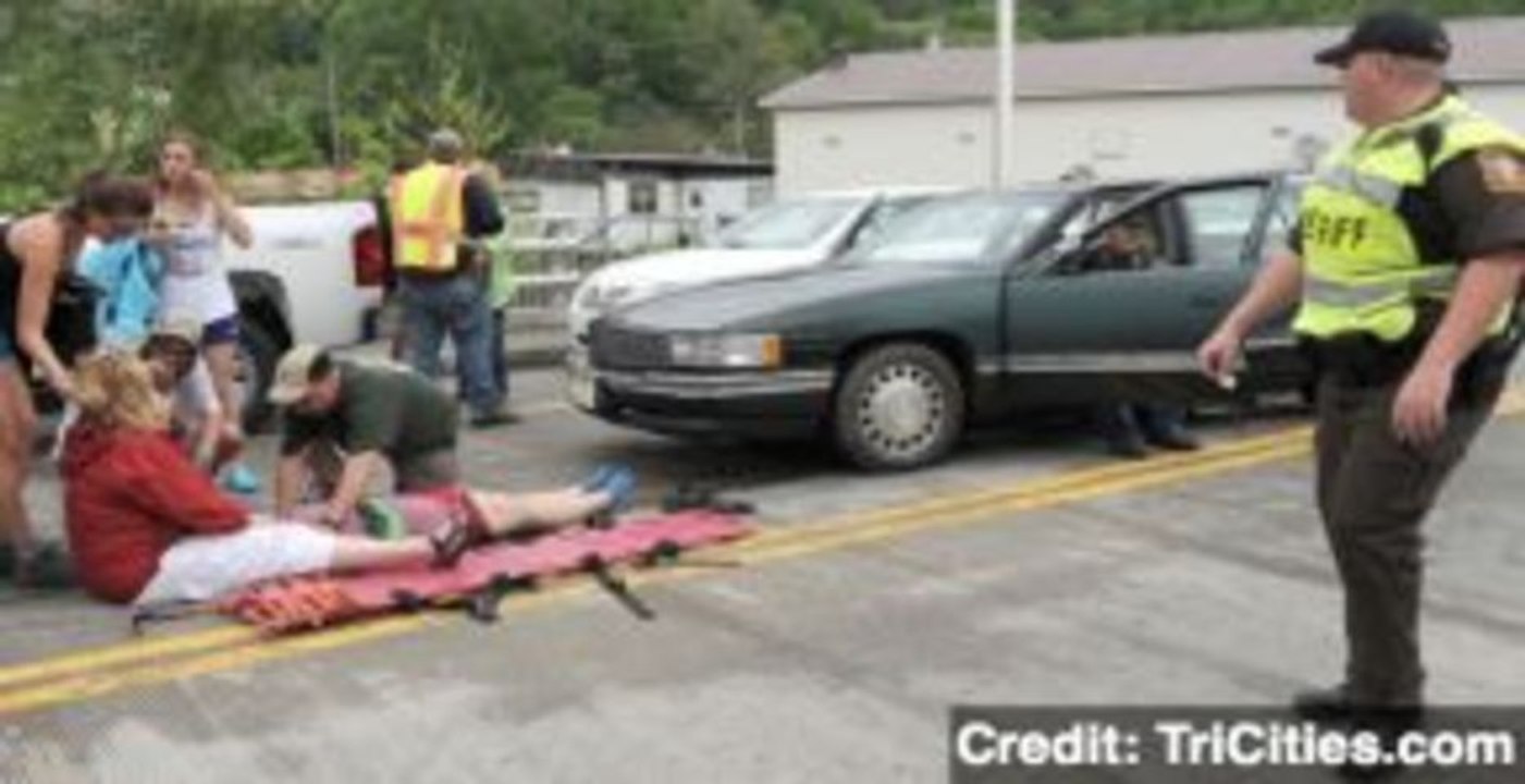 Car Plows Into Parade Crowd, Dozens Injured