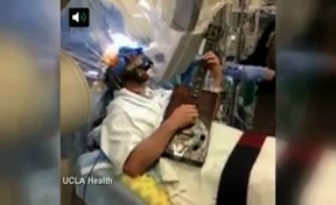 WATCH Patient plays the guitar during BRAIN SURGERY
