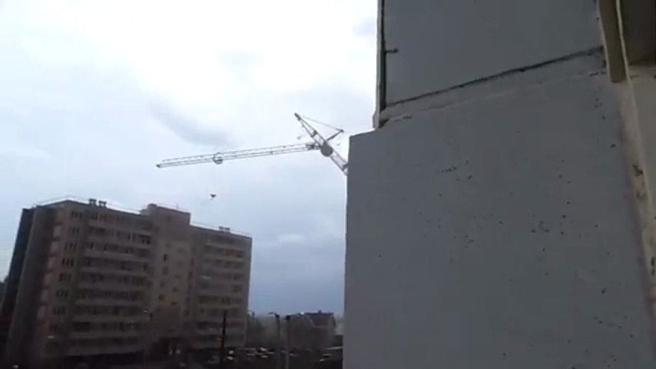 A crane falls on a building suddenly! Huge accident on a building site!