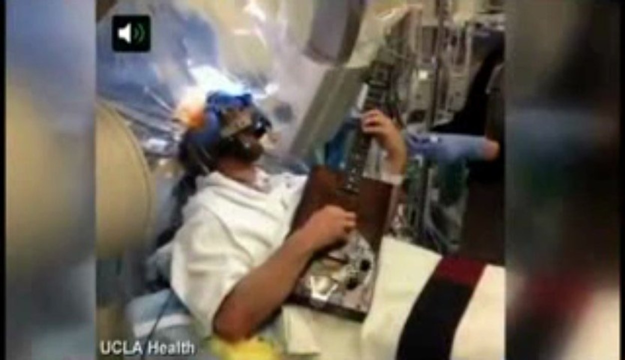 Patient plays the guitar during BRAIN SURGERY