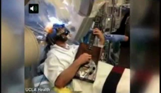 Patient plays the guitar during BRAIN SURGERY