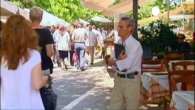 Greek economy shrinks further, EU hits back at IMF over...