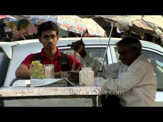 Boy drinking a lemonade in the hot summer of Delhi