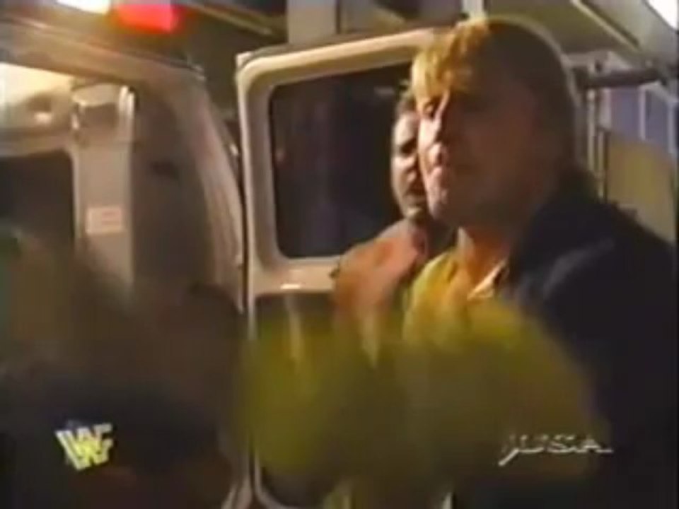 Steve Austin attacks Bret Hart on his way to the hospital 4/21/1997