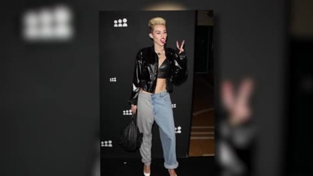 Miley Cyrus Flaunts Her Flat Tummy in a Racy Leather Crop Top