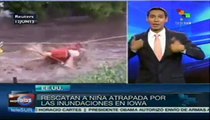 Bombero rescata a niña atrapada en inundaciones en Iowa