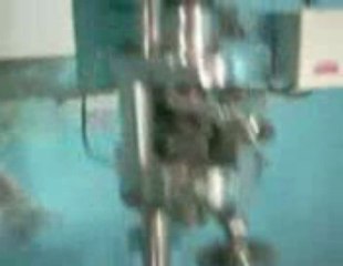 CAP SEALING AND THREADING MACHINE