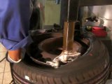 Changing the tire using the tire changer and tire balancing machine 5
