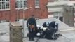 Police tackle G8 protester on rooftop