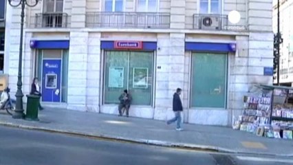 Greek shares and bond hit by coalition's problems