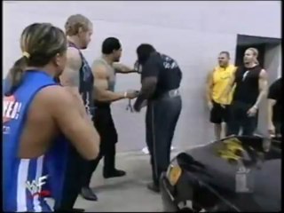 Mark Henry trys to hold back a limo with his legs for 30 seconds