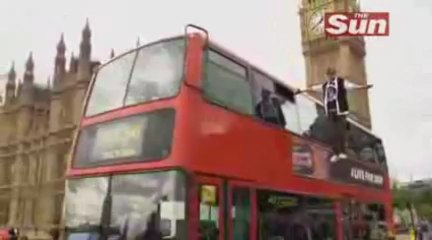 Magician levitates on side of London bus