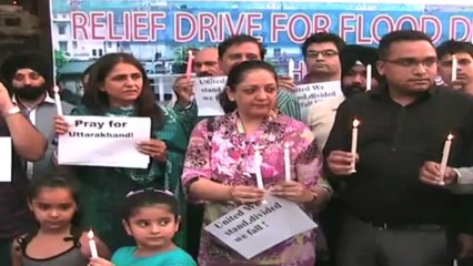 Candle light march for U'khand flood victims