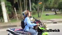 Birds flying next to a scooter and settleing on the driver!