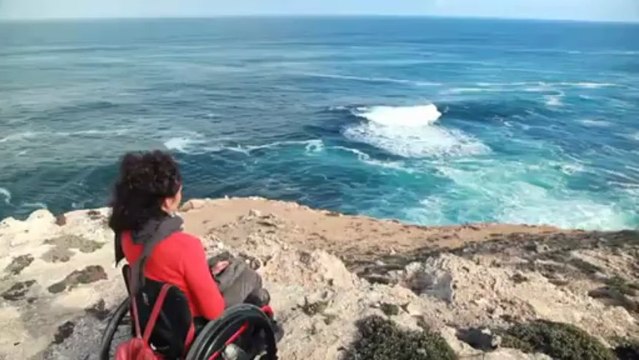 Paraplegic mother goes surfing with a friend via duct tape