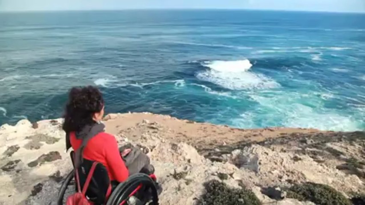 Paraplegic mother goes surfing with a friend via duct tape