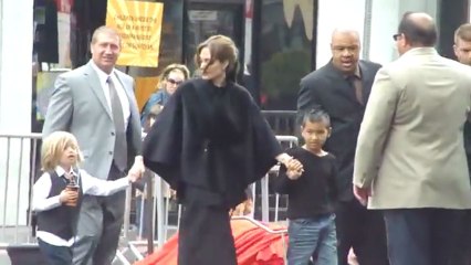Angelina jolie and brad pitt leave the kung fu panda 2 premiere with their children