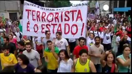 Protesters clash with police during Confederations Cup...