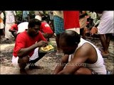 South Indian feast being served on banana leaves