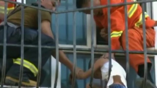 Boy rescued after getting trapped in railings in China