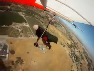 Hang glider in rapid descent struggles to release parachute