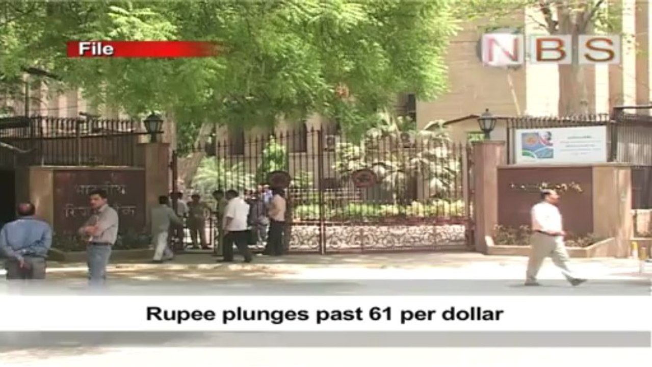 Rupee plunges past 61 per dollar