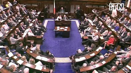 Irish MP pulls female colleague onto his lap