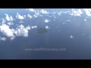 Green dots on a blue canvas with white specks: Andamans