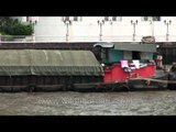 Close view of a cargo barge on river in Bangkok