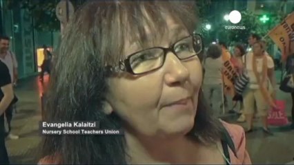 Greeks hold a protest concert on the eve of a third...