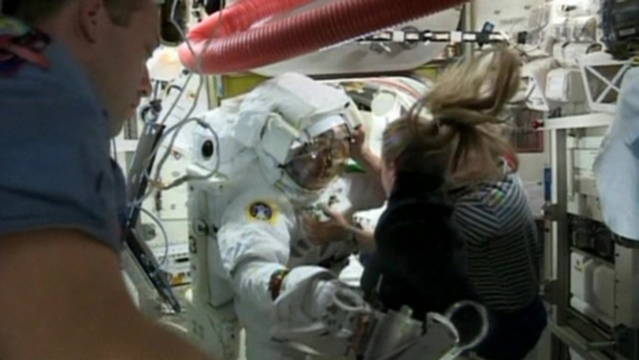 NASA aborts spacewalk after leak into astronaut's helmet
