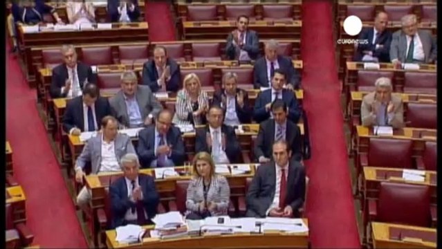 Greek parliament narrowly approves controversial job...