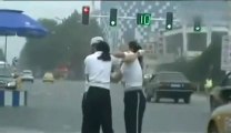 2 chinese police women fighting in the street!