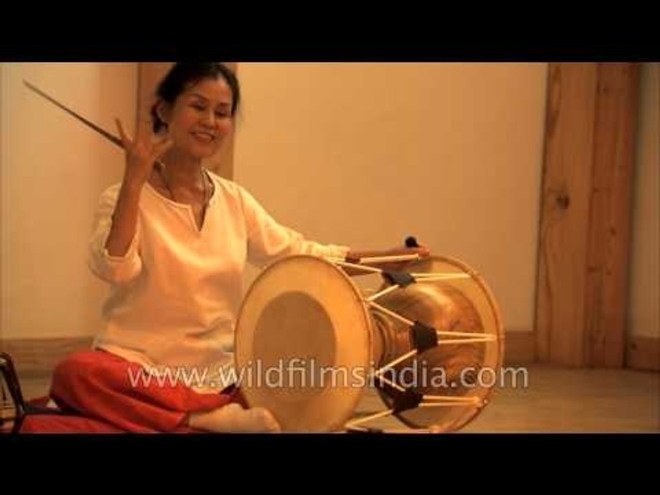 Instructor Park Eun Ha demonstrates drum techniques
