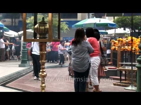 People light incense sticks at the Erawan Shrine in Bangkok