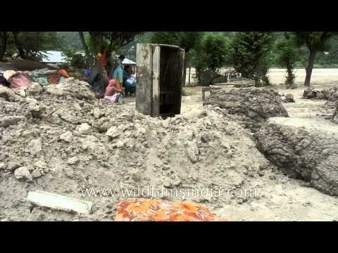 Silt is spreading around houses and forming mounds in Sili village, Uttarakhand