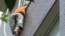 Chinese boy rescued dangling from 4th floor balcony