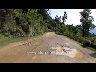 Puddle of muddy water on the roads to Guptkashi