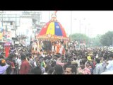 Devotees take part in pulling a chariot of Lord Jagannath Rath Yatra at Hauz Khas in New Delhi