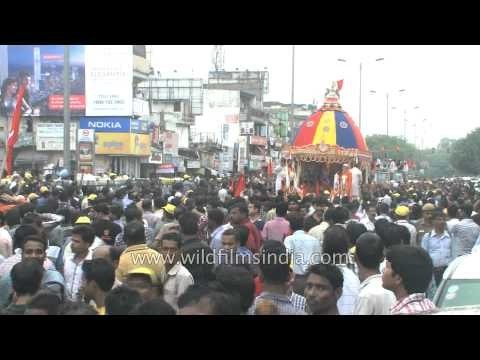 Devotees pull the chariot of Lord Jagannath during the traditional Jagannath Rath Yatra in New Delhi