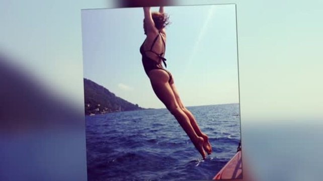 Kylie Minogue Dives in a Leopard Print Swimsuit in Another Holiday Snap