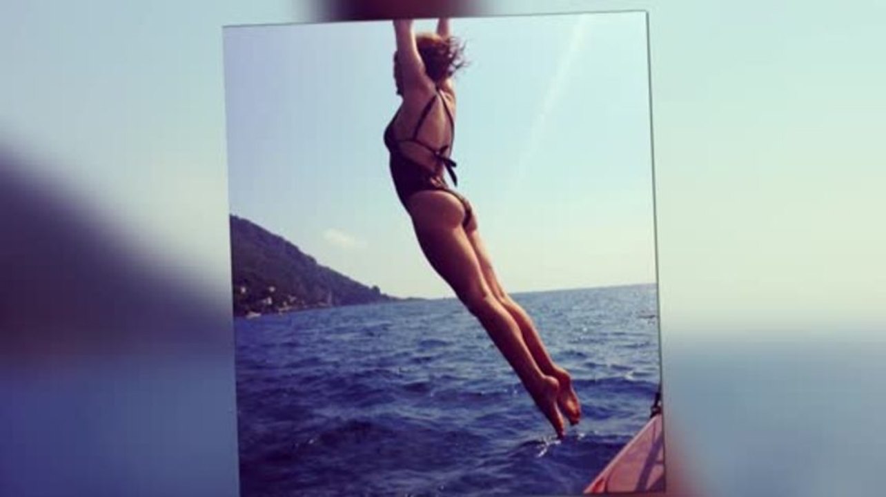 Kylie Minogue Dives in a Leopard Print Swimsuit in Another Holiday Snap