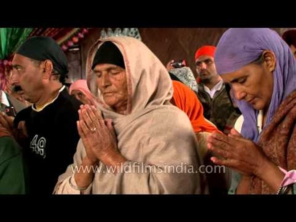 Pilgrims performing 'Ardas' ritual at Hemkund Sahib Gurudwara