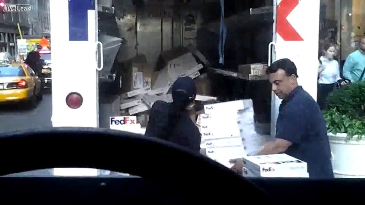 FedEx Employees Throwing Packages Into Truck