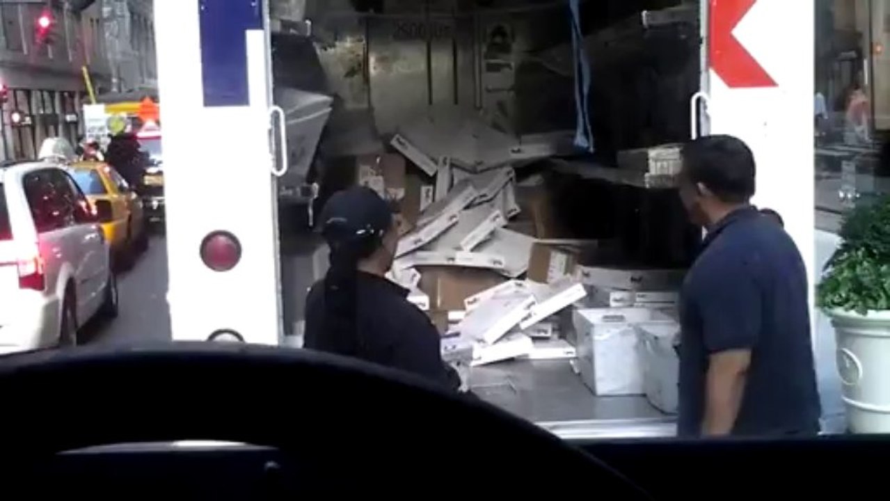 FedEx employee throwing items in truck - Bad FedEx reputation for safe & care transportation...