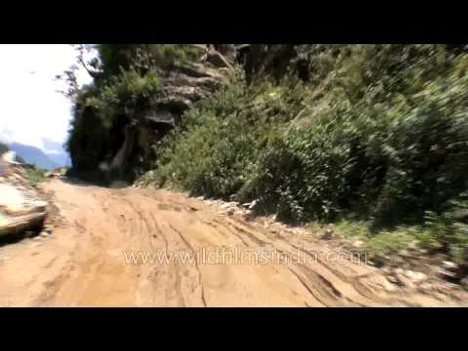 Partially damaged road on the way to Tilwara