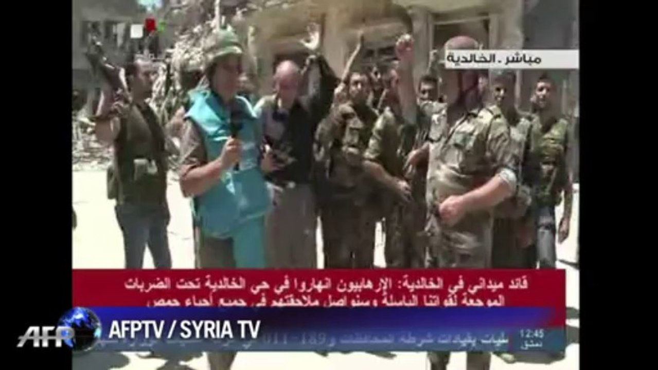 Syrian TV shows impact of heavy shelling in Homs