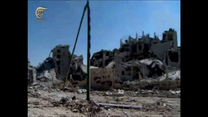 Tải video: Syrie: succès du régime avec la prise d'un quartier clé de Homs